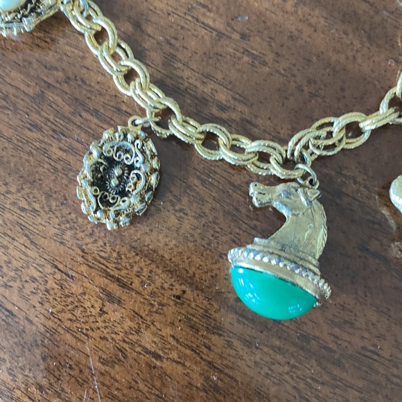 Gold tone charm necklace. Adjustable length. Great condition. - Picture 5 of 10